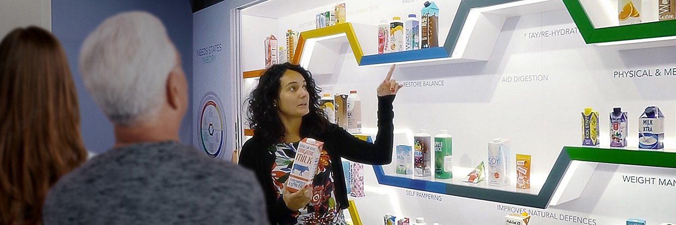 Woman with carton package in CIC workshop room