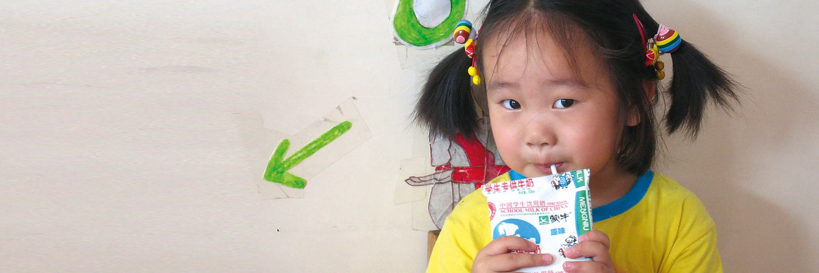 girl drinking from carton